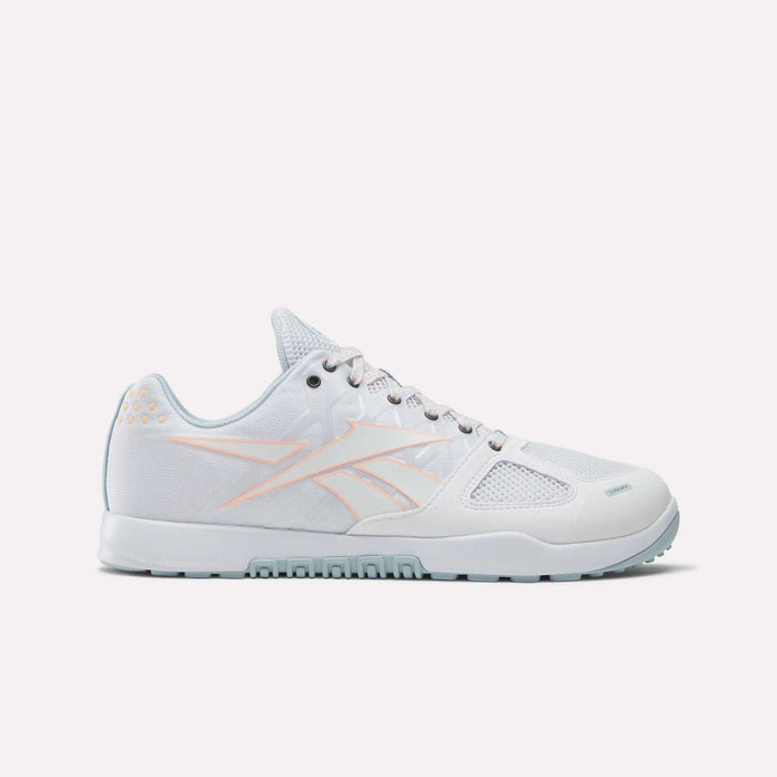 The Reebok Men's Nano 2.0 Training Shoes feature a white low-top design with light pink accents and mesh panels, perfect for functional fitness. Displayed on a plain white background.