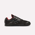 The Men's Nano 2.0 Training Shoes by Reebok are shown in a side profile view, featuring black with silver details, mesh toes, red lining, and a flat sole—perfect for functional fitness—against a plain white background.