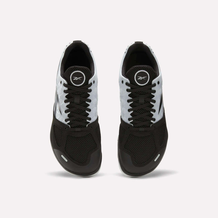 A pair of Men's Nano 2.0 Training Shoes by Reebok in black and white, featuring mesh uppers, laces, and the Reebok logo on the tongue, viewed from above on a plain white background—ideal for functional fitness.