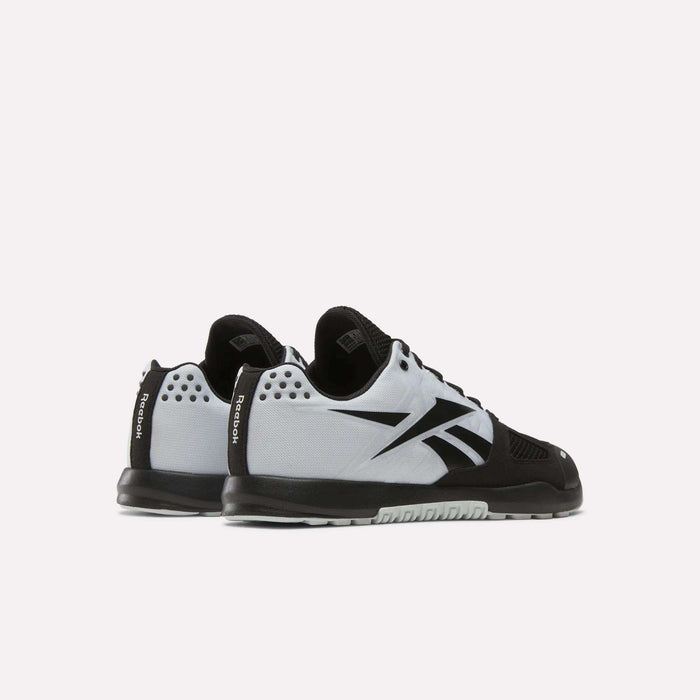 The Reebok Men's Nano 2.0 Training Shoes feature black soles and toes, light gray sides, and a bold black Reebok logo; shown at an angle to display their back and side views—perfect for functional fitness workouts.