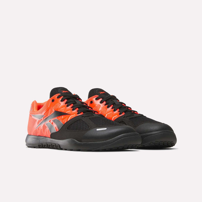 Reebok Men's Nano 2.0 Training Shoes with black mesh toes and laces, vivid red-orange sides, silver logo, and functional fitness style—shown on a plain white background.