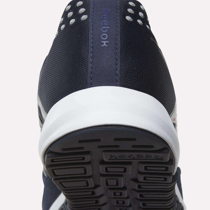 Close-up of the back and sole of the Men’s Nano 2.0 Training Shoes by Reebok in navy blue with white accents, highlighting the textured tread and a portion of the brand name on the heel—an ideal pick for functional fitness enthusiasts.