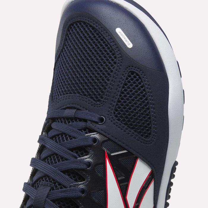The Reebok Men’s Nano 2.0 Training Shoes showcase a black mesh upper, navy blue overlays, dark blue laces, and a distinctive white and red side design. With a textured toe pattern and a small branded label for extra detail, these athletic shoes are ideal for functional fitness workouts.