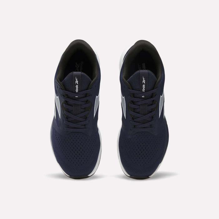 Top view of Reebok Men's Nanoflex Trainer 2 Shoes featuring navy blue uppers, white soles, and black interiors, displayed side by side on a plain white background.
