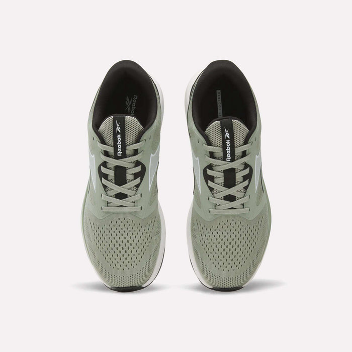 A pair of light green Reebok Men's Nanoflex 2 Training Shoes is shown from above, highlighting the laces, breathable mesh uppers, and black insoles featuring Reebok branding.