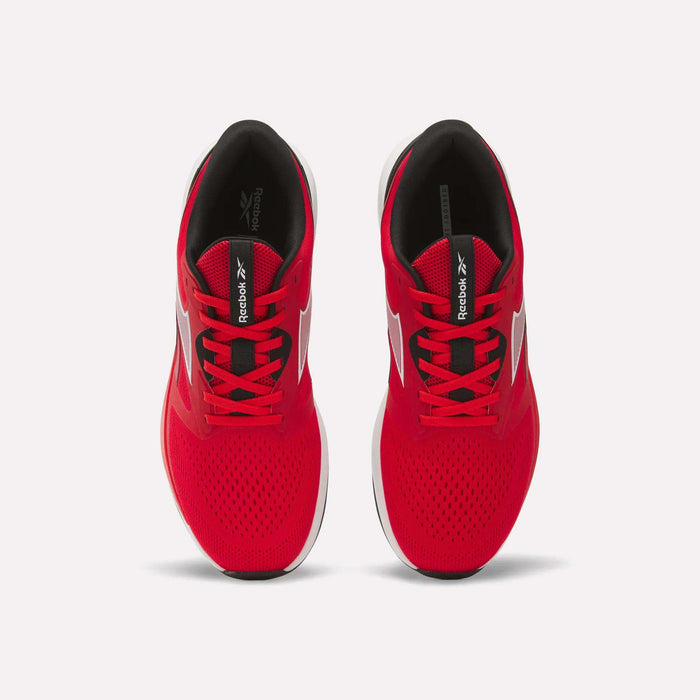Top view of a pair of Men's Nanoflex 2 Training Shoes by Reebok in bright red, featuring white soles, black interiors, and black Reebok logos on the tongues, displayed side by side on a white background.