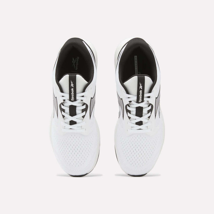 Top view of a pair of Reebok Men's Nanoflex 2 Training Shoes in white with black accents on a plain light background. These shoes feature breathable mesh uppers and visible Reebok branding on the tongues and sides.