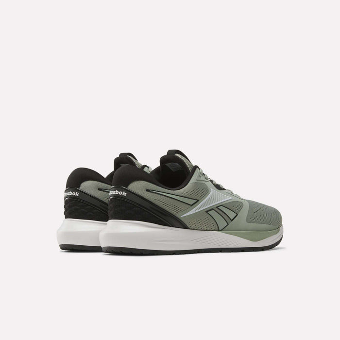 A pair of Reebok Men's Nanoflex 2 Training Shoes in green with black accents and white soles, crafted from breathable mesh, shown from a rear three-quarter angle against a plain white background.