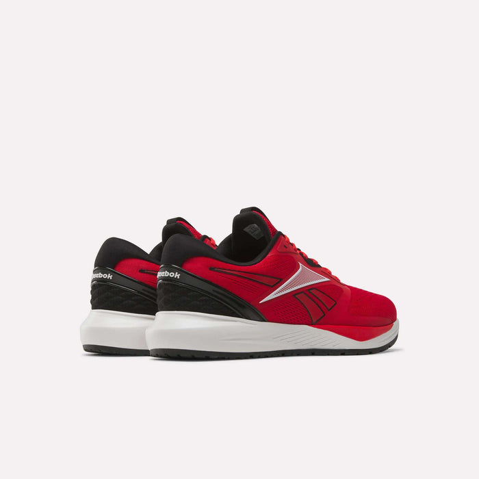 A pair of Reebok Men's Nanoflex 2 Training Shoes in red with black and white accents, featuring breathable mesh for enhanced comfort, shown from the back and side on a plain white background.