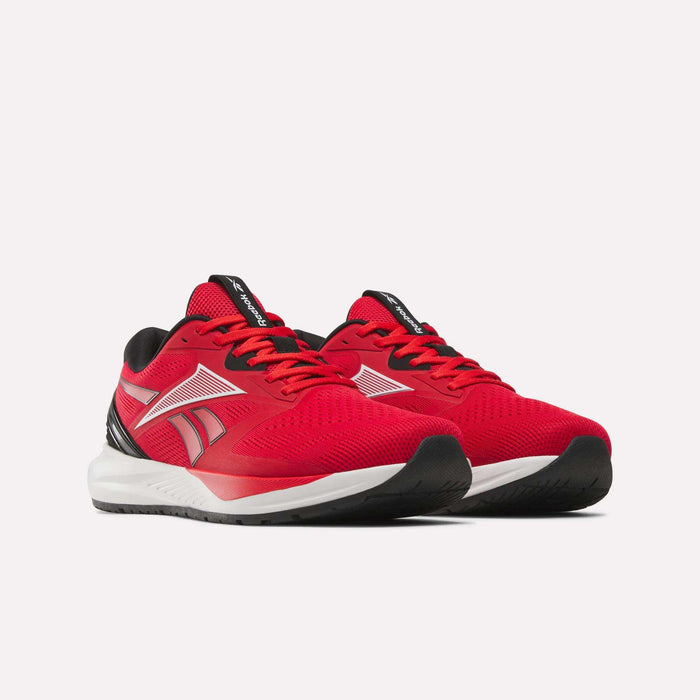 A pair of Reebok Men's Nanoflex 2 Training Shoes in red, featuring white soles, black accents, and the Reebok logo on the sides; these versatile workout shoes are designed with breathable mesh panels and are displayed against a plain white background.
