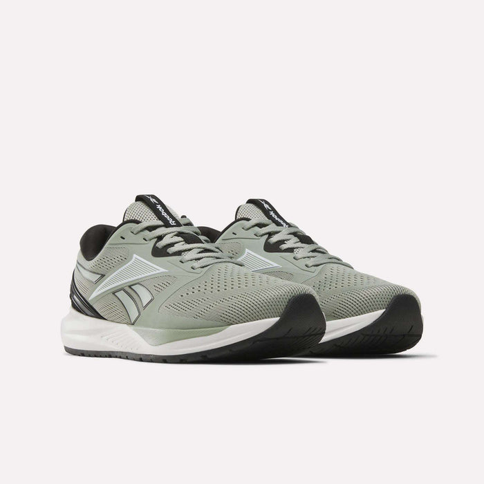 A pair of Reebok Men's Nanoflex 2 Training Shoes in light gray, featuring black and white accents, breathable mesh uppers, black soles, and “Reebok” branding on the tongues and sides, displayed on a white background—perfect workout shoes for any routine.