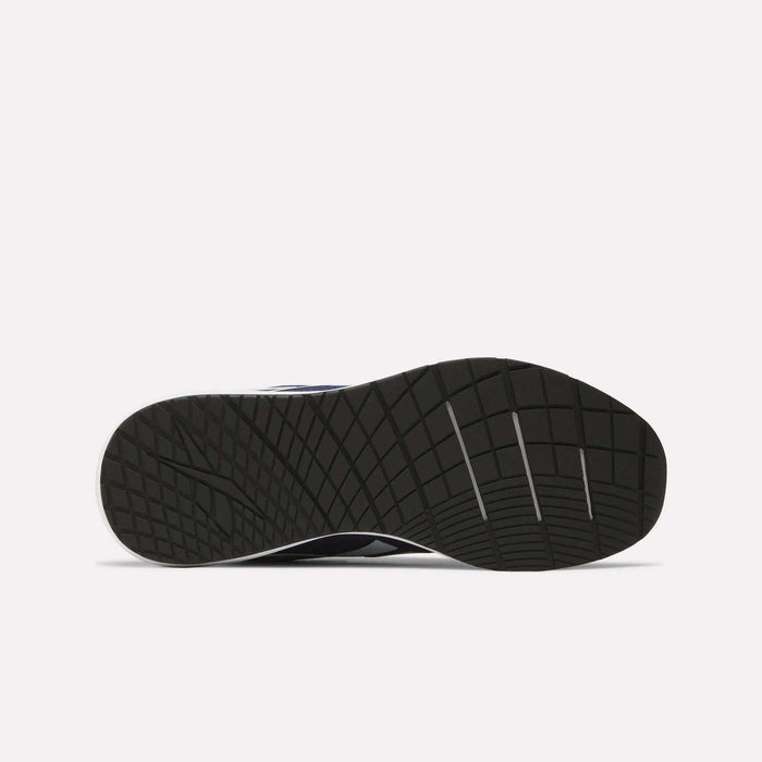The image displays the sole of Reebok Men's Nanoflex Trainer 2 Shoes, featuring a textured grid-like pattern with grooves for traction, against a plain white background.