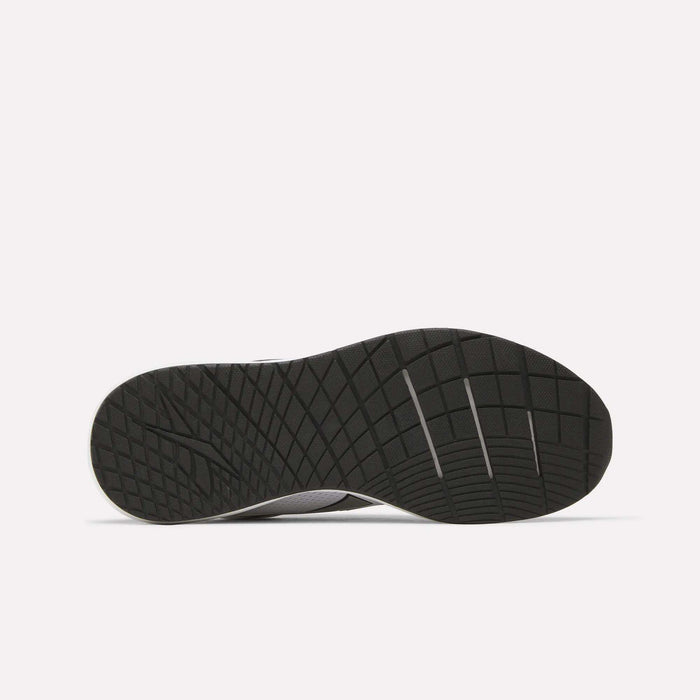 The image displays the underside of a black Reebok Men's Nanoflex 2 Training Shoe, featuring a textured, grid-like sole pattern designed for traction and durability. The shoe is set against a plain white background.