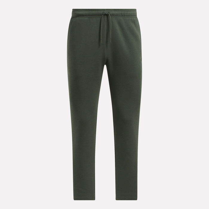 Men's Patent Pants by Reebok in dark green, with adjustable waistband and drawstring, slim fit tapered legs, shown on a plain light background.