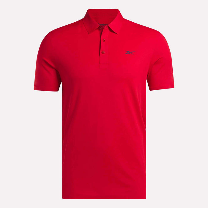 The Reebok Men's Short Sleeve Bonded Micro Pique Polo Shirt features a bright red color, classic collar, three-button front, small blue logo on the left chest, and moisture-wicking fabric for comfort.