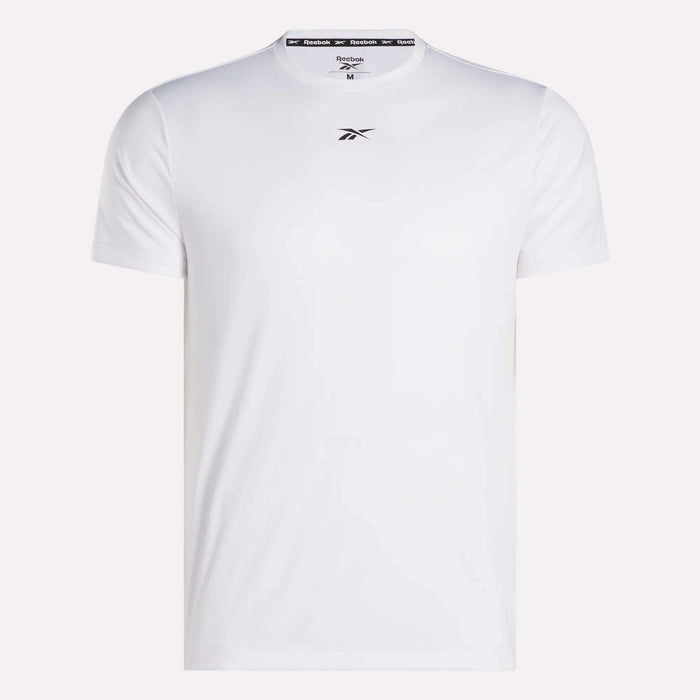 The Reebok Men's ID Train Short Sleeve Tech Tee is a white, sweat-wicking gym shirt featuring short sleeves and a small black logo on the chest. Shown against a white background.