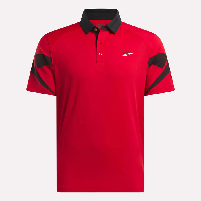 The Reebok Men's Signature Vector Colorblocked Polo Shirt is a red, moisture-wicking short-sleeve golf polo with black collar and sleeve accents and a small logo on the left chest.