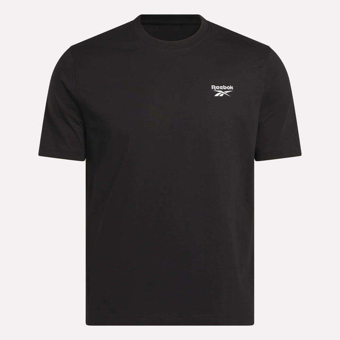 The Reebok Men's Small Logo Crewneck Short Sleeve T-Shirt is a plain black cotton jersey tee, featuring short sleeves and a small white Reebok logo on the upper left chest, shown against a light background.