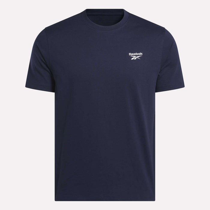 The Reebok Men's Small Logo Crewneck Short Sleeve T-Shirt in navy blue features a classic fit, soft cotton jersey fabric, and a small white Reebok logo on the left chest.