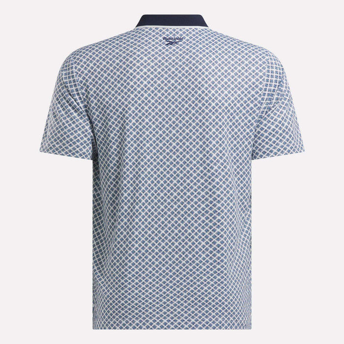Back view of the Men’s Sublimation Print Shirt by Reebok, featuring a sweat-wicking fabric, blue and white diamond pattern, dark collar, and the Reebok logo at the upper back below the collar.