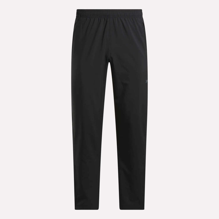 The Reebok Men's Train Woven Unlined Pants feature a black design with an elastic waistband and straight legs. Lightweight and pocketless, they're ideal for gym or daily wear, shown here on a plain white background.