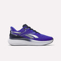 A side view of the Reebok Men's Viva Speed Shoes in Breakout Blue, Vector Navy, and White, featuring a white sole, black laces, and a black outsole on a plain white background. Designed for comfort, these cushioned shoes provide supportive strides.