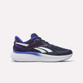 Introducing the Men's Viva Speed Shoes by Reebok in Vector Navy, Breakout Blue, and Rival Red—these athletic sneakers feature a dark blue design with vibrant blue and red accents, a thick white sole, and are built for performance with breathable materials and cushioned comfort. Shown here against a clean, light backdrop.
