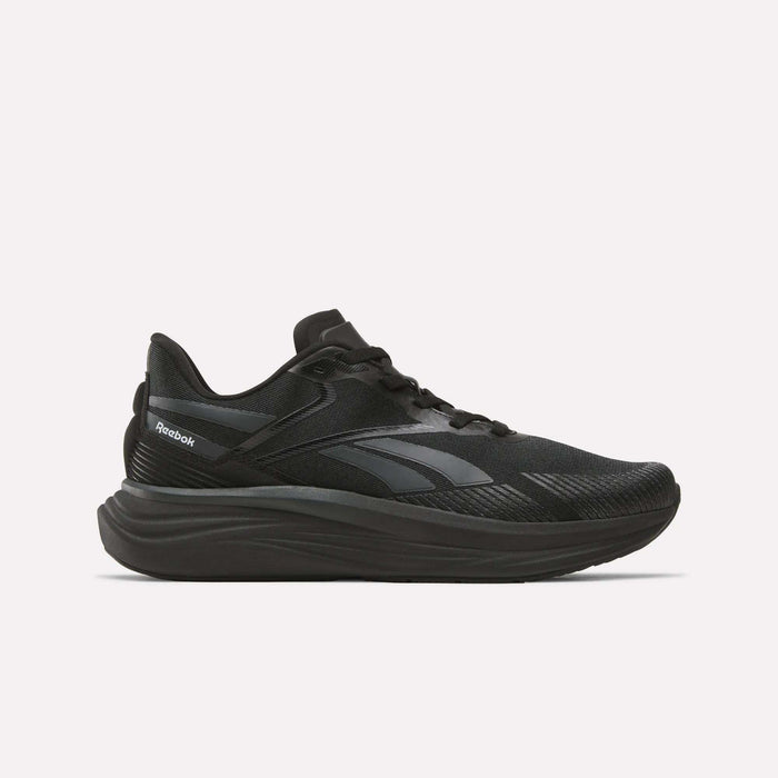 The Reebok Men's Viva Speed Shoes, shown in black with dark gray accents and a thick cushioned midsole for comfort, are displayed in side profile against a plain light background.