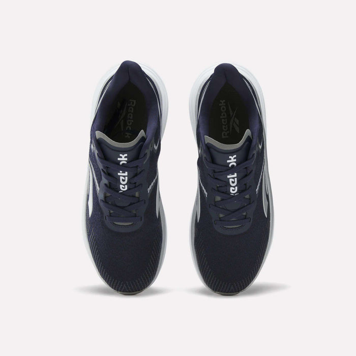 Top view of a pair of Reebok Men's Viva Speed Shoes in navy blue, featuring breathable material, white soles, and white Reebok logos on the tongues, placed side by side on a plain white background.