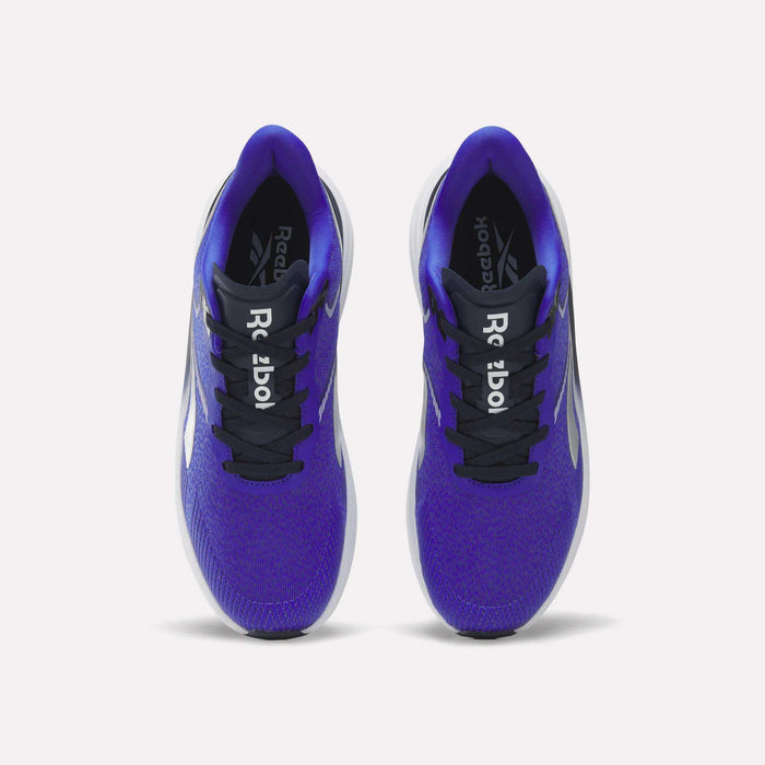 A pair of blue Reebok Men's Viva Speed Shoes viewed from above. These shoes feature black laces, black tongues with white Reebok logos, and white midsoles. Designed for added comfort with cushioned support, the insides display the brand name in white on a black background.