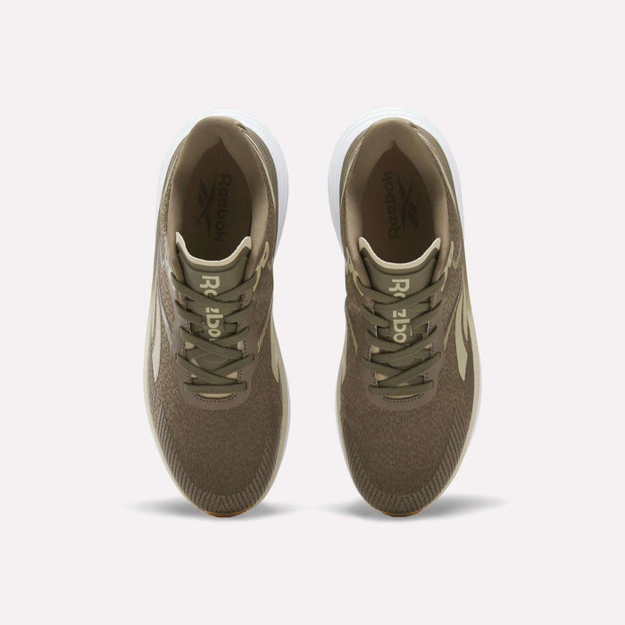 Top view of a pair of Reebok Men's Viva Speed Shoes in brown, featuring white soles, beige laces, and the Reebok logo on both the insoles and tongue, displayed side by side on a white background. These cushioned sneakers deliver style and comfort for everyday wear.
