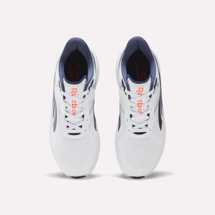 A pair of Men's Viva Speed Shoes by Reebok in white with navy and orange accents, shown from above on a light background. Designed for breathability and cushioned support, these shoes are ideal for running and everyday comfort.