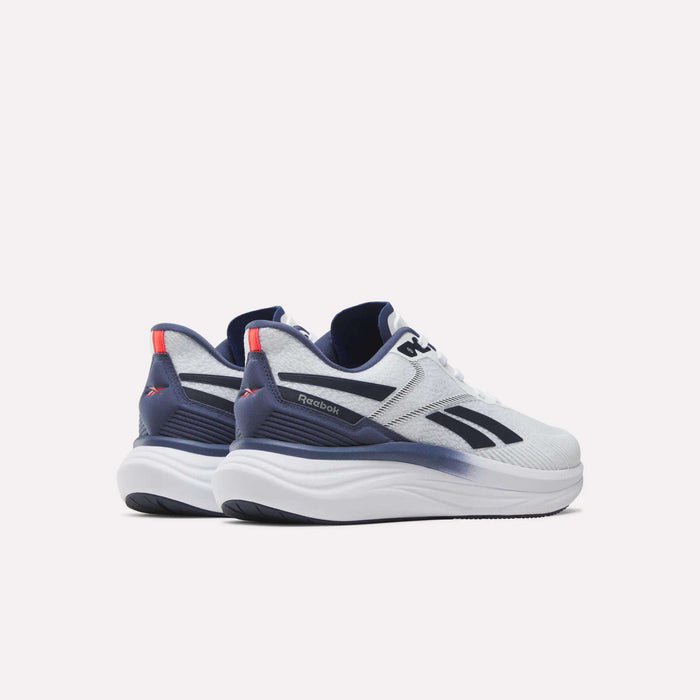 A pair of Reebok Men's Viva Speed Shoes in white with navy blue and red accents, displayed from a rear side angle on a plain white background. These cushioned running shoes are crafted for comfort and style, making them ideal for everyday wear.