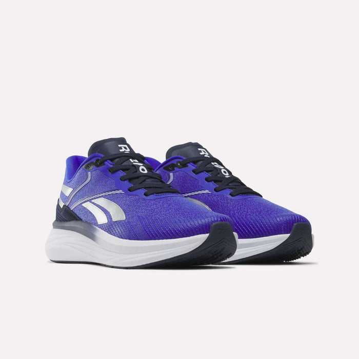 A pair of Reebok Men's Viva Speed Shoes in blue and white, with black laces and soles, featuring a cushioned midsole for added comfort, displayed on a white background.