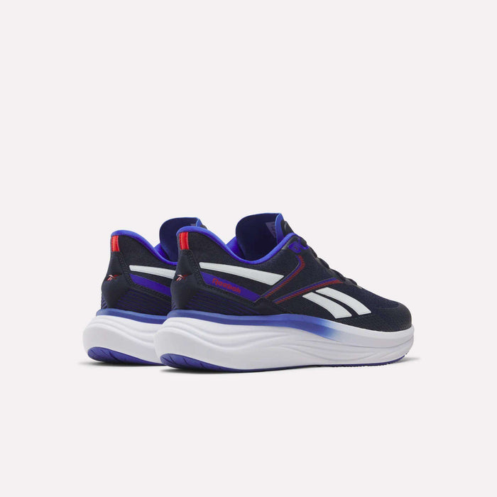 The Reebok Men's Viva Speed Shoes feature a black and white athletic design with striking blue and purple accents, thick white soles, and bold red highlights. Positioned on a light background facing away from each other, these sneakers provide breathable comfort and cushioned support, making them ideal for everyday wear.