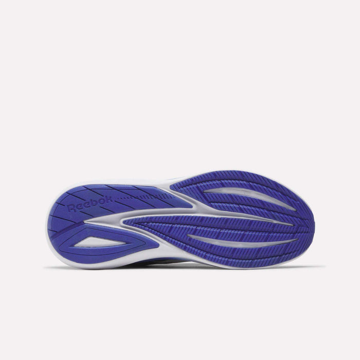 The image displays the purple and white sole of the Men's Viva Speed Shoes by Reebok, viewed from underneath. The tread incorporates multiple grooves and patterns for enhanced grip, with the Reebok logo visible near the heel—highlighting the durable design characteristic of cushioned footwear.