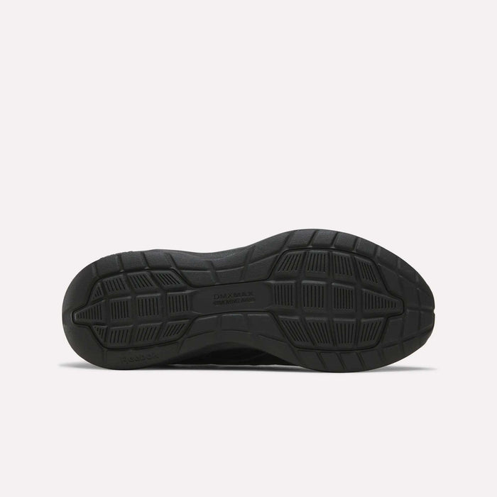Black sneaker outsole viewed from the bottom, revealing a textured tread pattern with grooves and geometric shapes for traction—ideal for those seeking features similar to the Reebok Men's Walk Ultra 7 DMX Max Shoes - Wide 4E. The text DAY MAX and COLE HAAN are visible in the center.