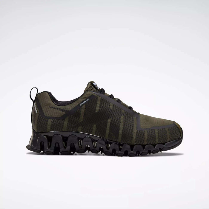 The Reebok Men's ZigWild Trail 6 Shoes feature a dark green and black mesh upper, wavy segmented sole, and lace-up closure for enhanced cushioning. Shown in side profile on a light background, they blend trail-inspired style with top performance.