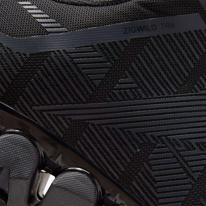 Close-up of the Reebok Men's ZigWild Trail 6 Shoes in black, featuring textured geometric patterns, glossy accents, and “ZIGWILD TR6” on the upper—trail-inspired design with enhanced cushioning for all-day comfort.