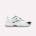 The Reebok Nano Golf Shoes are white with black accents, a textured sole, mesh panels, lace-up design, and FlexWeave upper. Shown from the side against a plain light background.