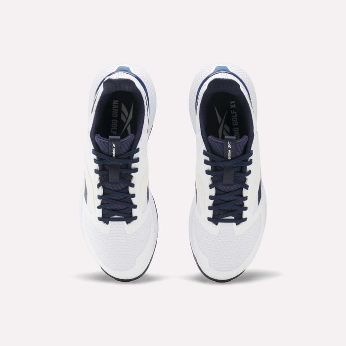 Top view of a pair of Reebok Nano Golf Shoes with white FlexWeave uppers, dark blue laces and accents. The performance shoes are side by side, facing forward on a light background.