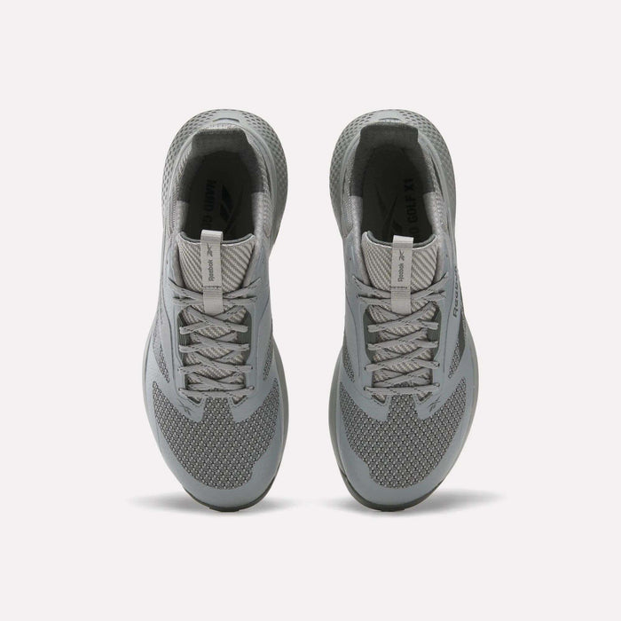 A pair of gray Reebok Nano Golf Shoes viewed from above, featuring laces, mesh texture, cushioned collars, and a lightweight FlexWeave upper for breathability and support against a plain white background.