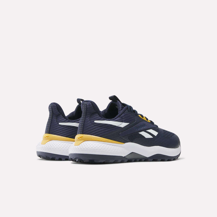 A pair of Reebok Nano Golf Shoes in dark blue with white midsoles, yellow accents, and white logos. They feature a lightweight FlexWeave upper and are shown from a rear-side angle on a plain light background.