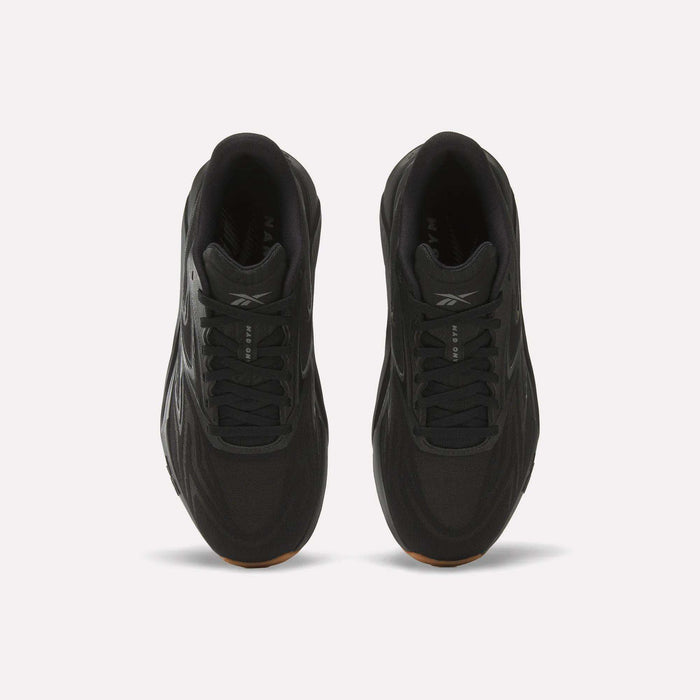 Top view of Reebok Nano Gym 2.0 Training Shoes in black with black laces, subtle logo on the tongue, and high-rebound foam cushioning, displayed on a plain white background.