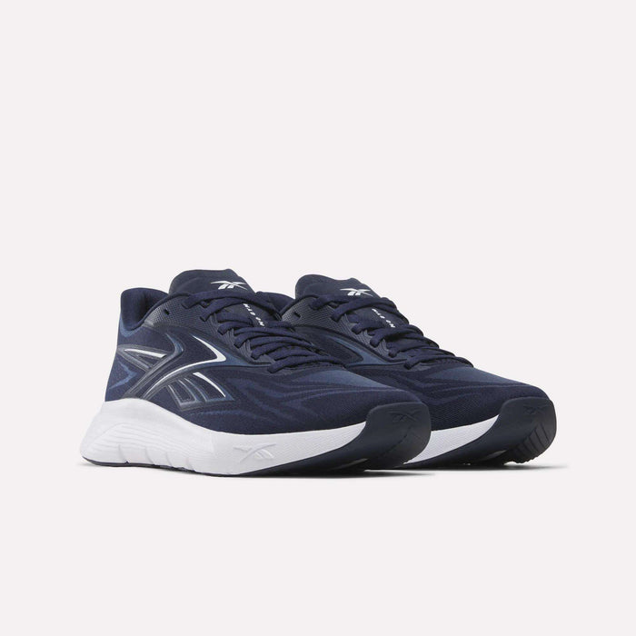 Step into the gym in style with Reebok Nano Gym 2.0 Training Shoes—navy blue with white soles and white/silver side logos—set against a plain light background, perfect for all your workouts.