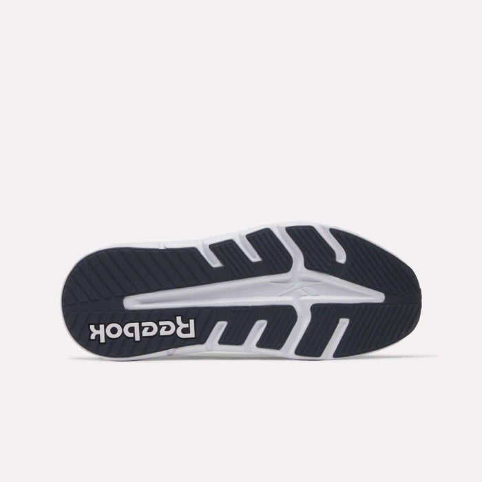 The image displays the sole of the Reebok Nano Gym 2.0 Training Shoe, highlighting its black and white rubber tread with deep grooves and textured patterns, plus a white Reebok logo near the heel.