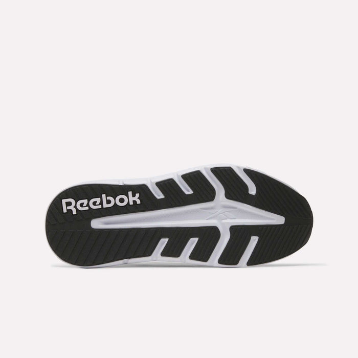 The image displays the black and white rubber outsole of the Reebok Nano Gym 2.0 Training Shoes, featuring a geometric tread pattern for grip and the white Reebok logo on the heel.