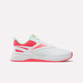 The Reebok Nano Play Shoes for little kids feature a white design with pink and mint green accents, including a pink sole and mesh panels plus a mint green heel tab and collar, all crafted for a kid-specific fit and shown on a plain white background.