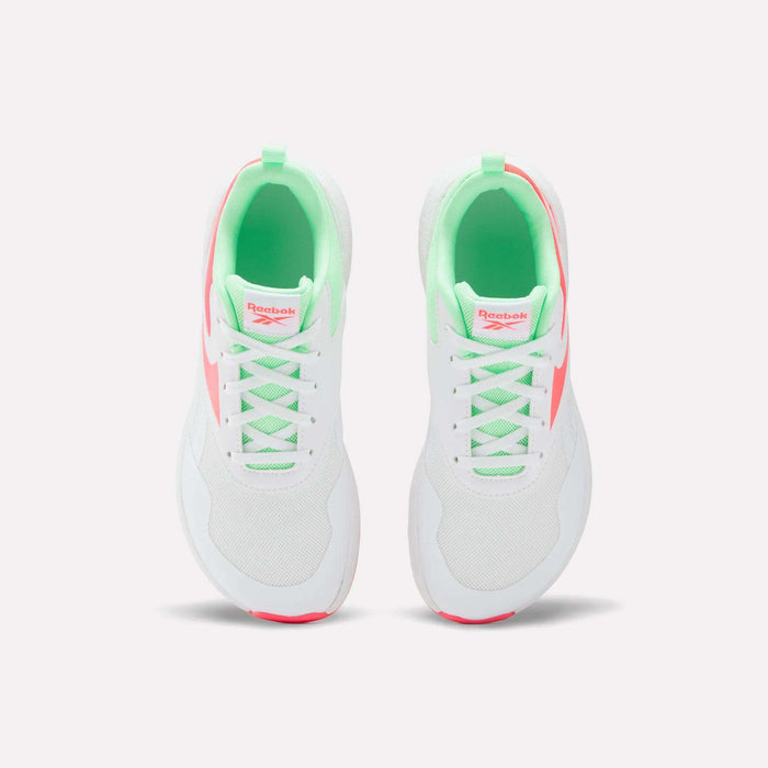 Top view of Reebok Nano Play Shoes for little kids, featuring a neon green inner lining and pink logo on the tongue with pink accents. Designed for kids’ comfort, these athletic shoes are shown on a plain white background.