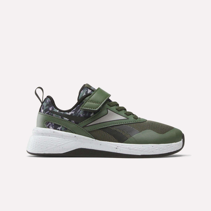 The Reebok Nano Play Stretch Lace And Top Strap Shoes for little kids feature a green and black design with a white sole, black laces, Velcro strap, and a camouflage heel/collar, shown against a plain light background.